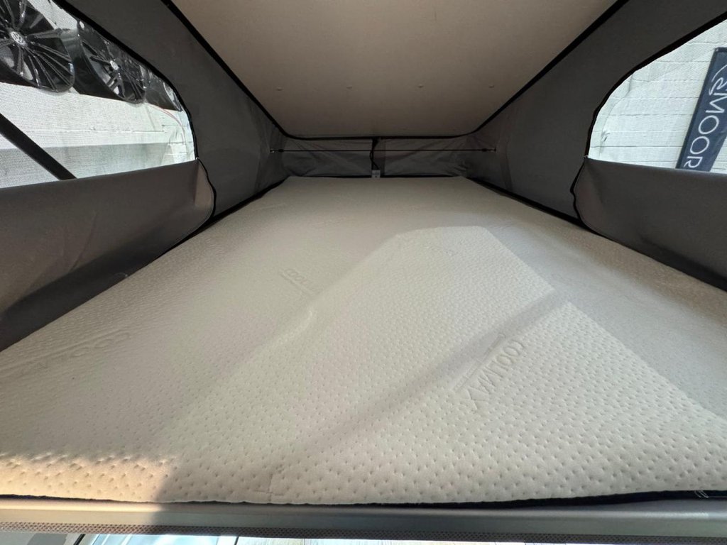 Pop-top double bed made up with mattress